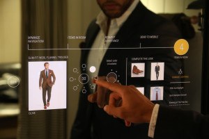 A Polo Ralph Lauren associate trying out the interactive fitting room.