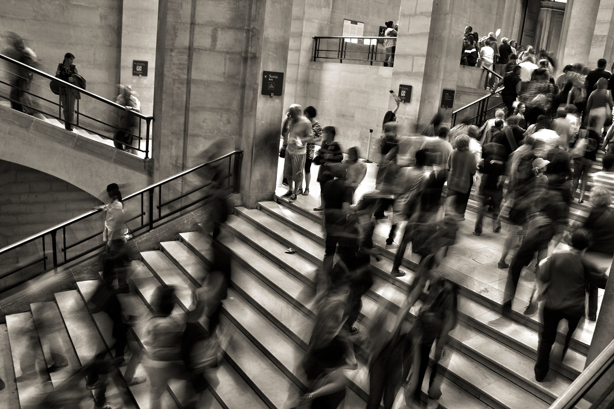 Busy stairs in large building people blurred