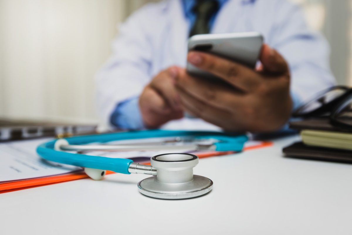 medic-working-with-modern-smart-phone