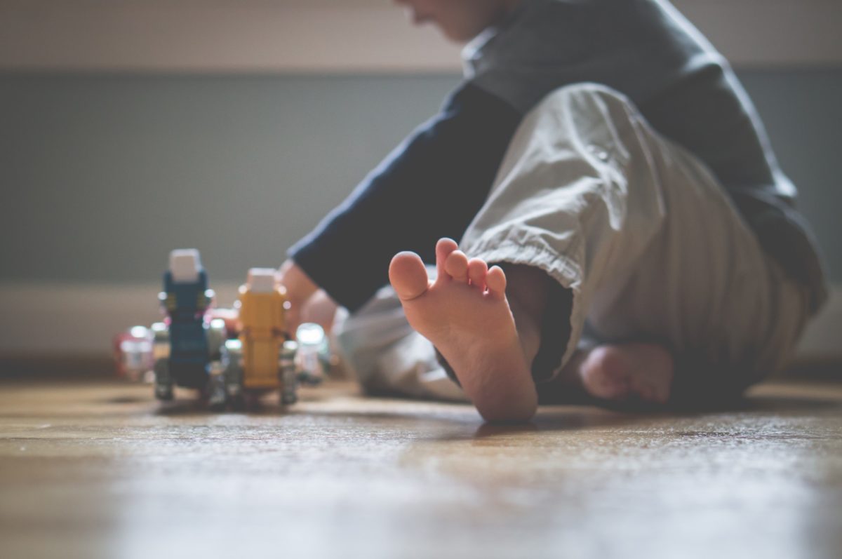 Child playing with robots