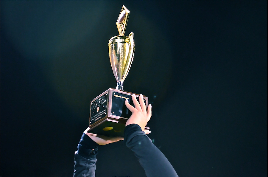 Someone holding up trophy