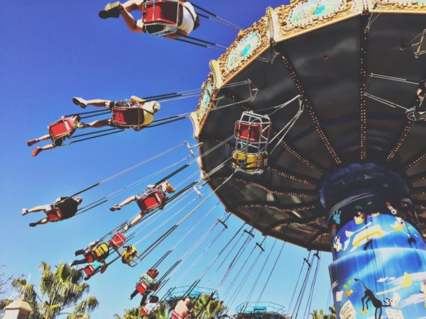 People on rotating swing at a fair