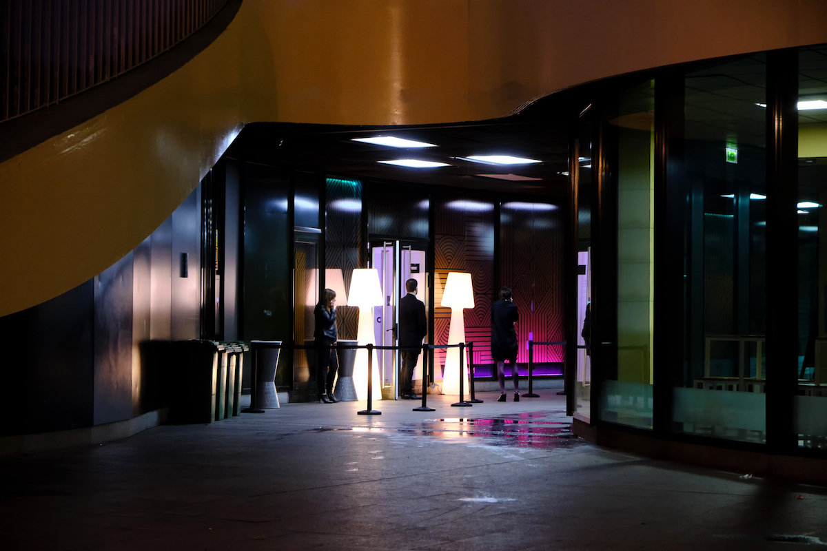 People waiting in entrance of hotel